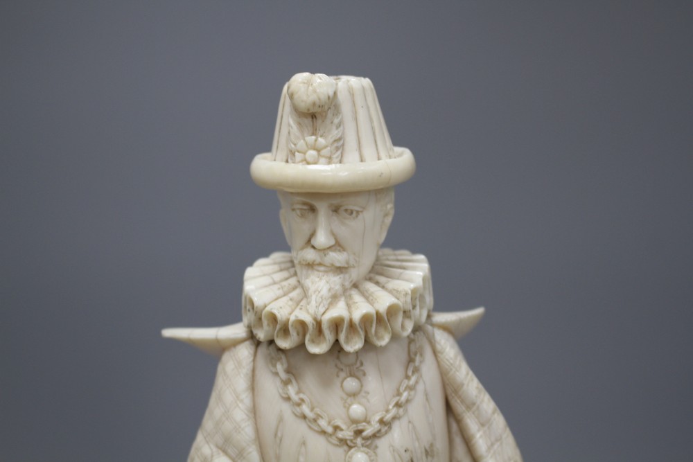 A 19th century Dieppe carved ivory figure of a 17th century gentleman, standing and wearing a ruff colour, height 30cm,